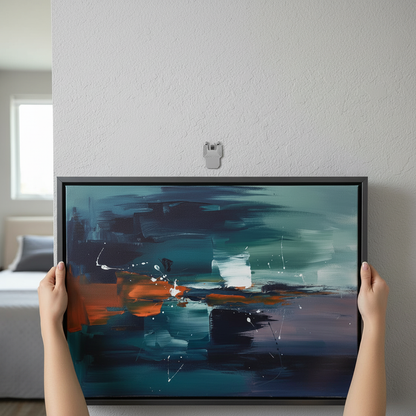 Person holding a framed abstract painting against a wall